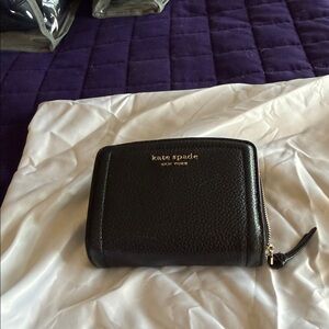 kate spade black pebbled leather zip-around wallet with gold logo